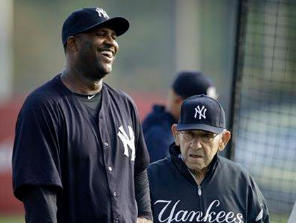 New York Yankees Derek Jeter hugs Sergio Mitre after hitting